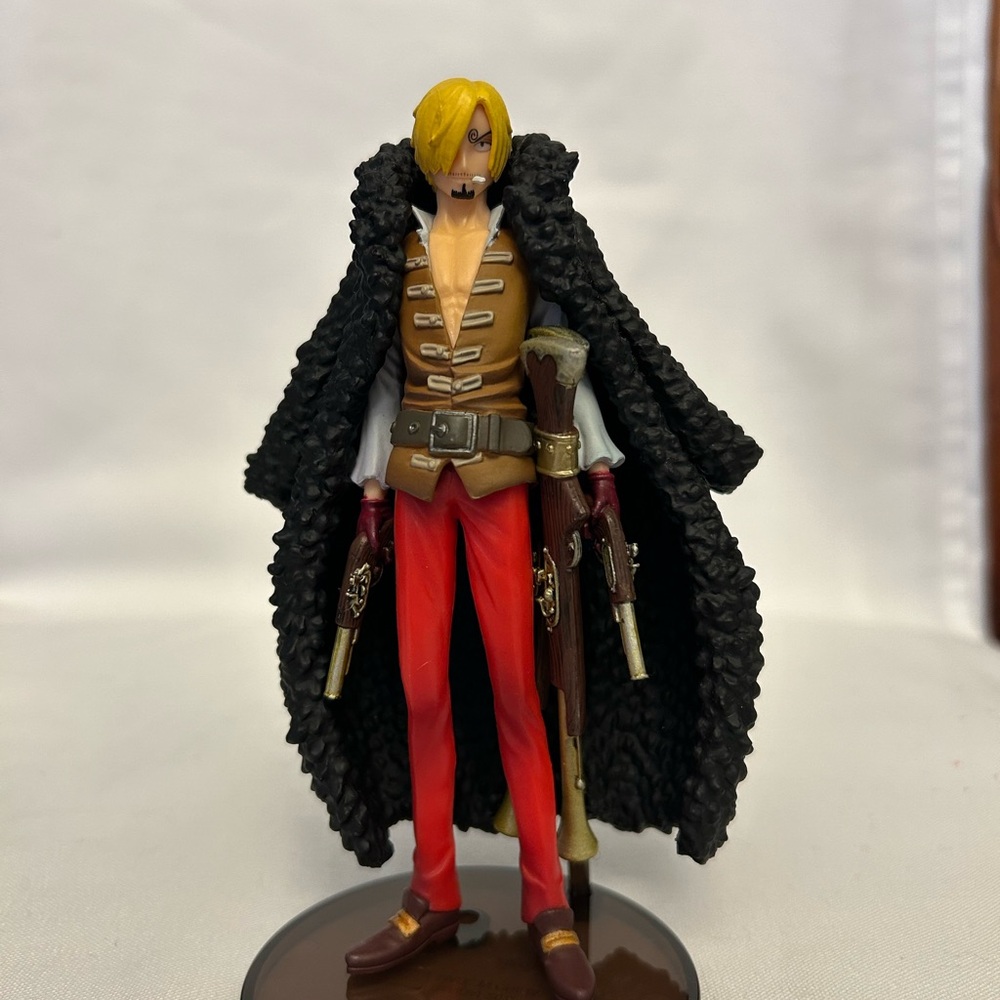 Action Figure with Black Coat and Red Pants